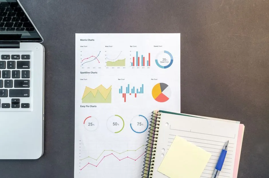 Notebook and printed charts used for data analysis